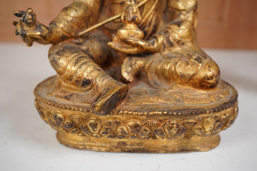 A gilt bronze figure of Padmasambhava, 22cm